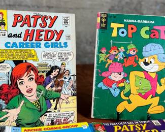 This lot features a large collection of antique comic books with numerous titles including, Top Cat, Patsy Walker, Archie, and more.