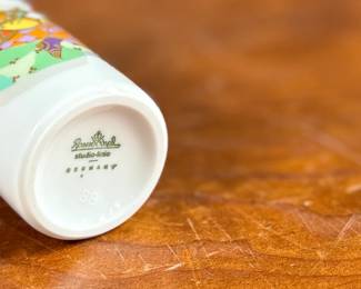 This lot features a vintage 1970s porcelain vase designed by Bjørn Wiinblad for Rosenthal Studio-Linie, featuring a whimsical colorful illustration of a harp player. Measures, 4” H and comes in excellent condition.