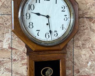 This lot features an antique 8-day clock in good running condition with a Sessions movement. Includes key and measures, 25” H x 16” W.