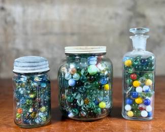 This lot features a large marble collection with three (3) containers filled!