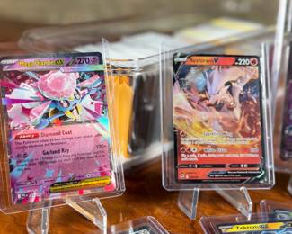 This lot features a large Pokemon trading card game collection including tons of holos, a graded 2023 Pokemon Jynx EX from the 151 set by CGC, and some Japanese/Korean cards.