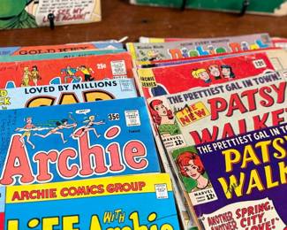 This lot features a large collection of antique comic books with numerous titles including, Top Cat, Patsy Walker, Archie, and more.
