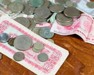 This lot features a large collection of foreign currency, primarily from the Philippines and Hong Kong.