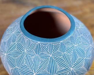 This lot features a stunning pottery vessel by listed artist, Debra Waconda. Signed underneath as shown in photos and measures, 5” H. Debra Waconda is a renowned Acoma Pueblo artist known for hand-coiling, painting, and signing fine-line black-on-white pottery, frequently featuring geometric patterns and intricate designs, with active pieces dating from the 1990s and 2000s. Her work, along with other Acoma potters such as Elizabeth Waconda, is considered authentic Native American Pueblo art.
