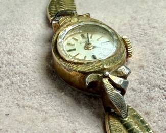 This lot features a 10k gold-filled mechanical watch by Zodiac. Winds and runs.