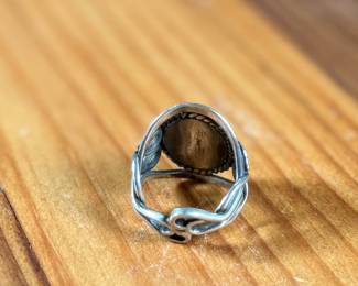 This lot features a beautiful handmade ring crafted from sterling silver with a Jasper center stone in a size 7.