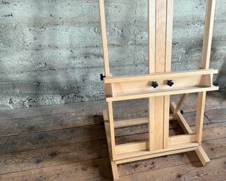 This lot features a large adjustable art studio easel made of Beechwood and in very good condition. Measures up to 6” H.