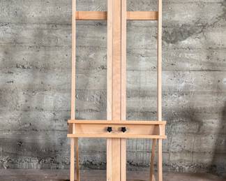This lot features a large adjustable art studio easel made of Beechwood and in very good condition. Measures up to 6” H.