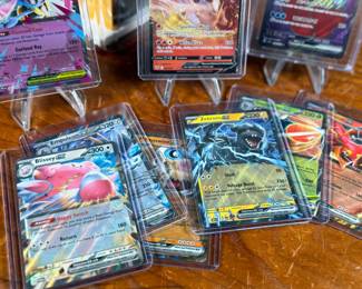 This lot features a large Pokemon trading card game collection including tons of holos, a graded 2023 Pokemon Jynx EX from the 151 set by CGC, and some Japanese/Korean cards.