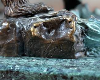 This lot features a bronze bear sculpture on a stone plinth by SPI Gallery. Signed as shown in photos and measures, 7” H x 10” W x 5” D.