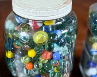 This lot features a large marble collection with three (3) containers filled!
