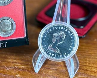 This lot features a Canadian silver dollar composed of 50% silver and a United States proof set from 1979.