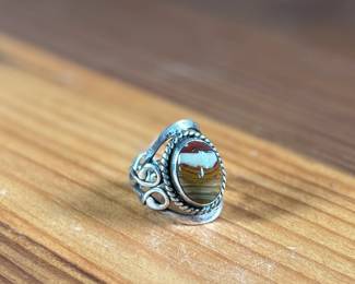 This lot features a beautiful handmade ring crafted from sterling silver with a Jasper center stone in a size 7.