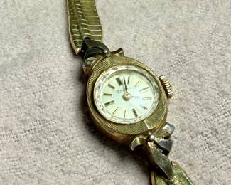 This lot features a 10k gold-filled mechanical watch by Zodiac. Winds and runs.