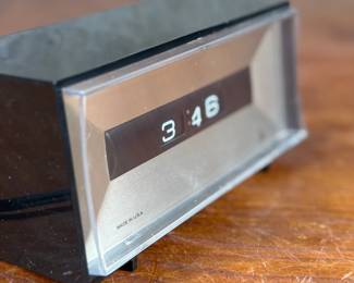 This lot features a vintage Lux electric flip clock circa 1970s in good working condition.