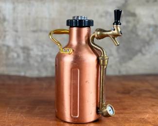 This lot features a GrowlerWerks uKeg pressurized beer growler in a copper finish. Works as it should and is in good overall condition.