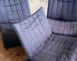 This lot features three (3) Kebe Ribbon Chairs designed by Niels Bendtsen in 1975, featuring a black tubular steel frame and quilted fabric. Each chair measures, 28” H x 25” W x 29” D.