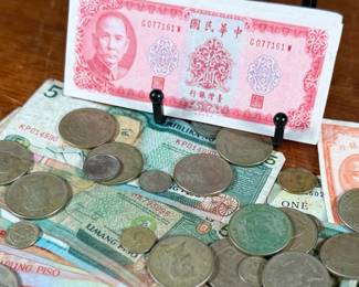 This lot features a large collection of foreign currency, primarily from the Philippines and Hong Kong.