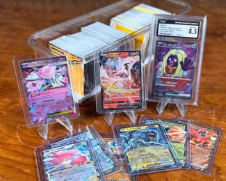 This lot features a large Pokemon trading card game collection including tons of holos, a graded 2023 Pokemon Jynx EX from the 151 set by CGC, and some Japanese/Korean cards.