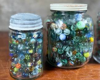 This lot features a large marble collection with three (3) containers filled!
