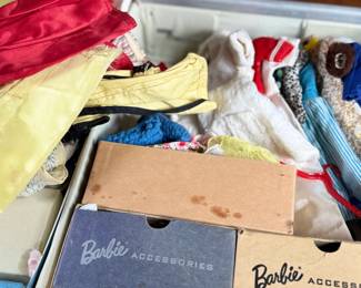This lot features a vintage 1961 Mattel Barbie Ponytail carrying case full of barbies and accessories.
