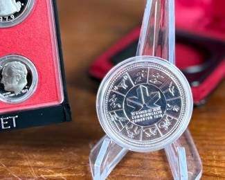 This lot features a Canadian silver dollar composed of 50% silver and a United States proof set from 1979.