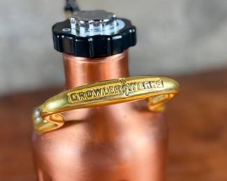 This lot features a GrowlerWerks uKeg pressurized beer growler in a copper finish. Works as it should and is in good overall condition.