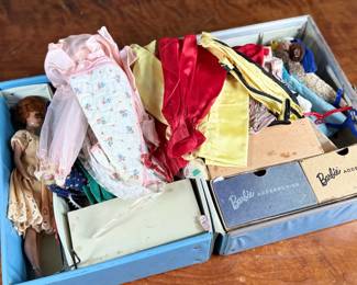 This lot features a vintage 1961 Mattel Barbie Ponytail carrying case full of barbies and accessories.