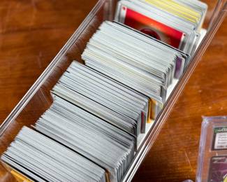 This lot features a large Pokemon trading card game collection including tons of holos, a graded 2023 Pokemon Jynx EX from the 151 set by CGC, and some Japanese/Korean cards.