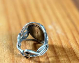 This lot features a beautiful handmade ring crafted from sterling silver with a Jasper center stone in a size 7.