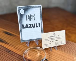 This lot features a set of handcrafted sterling silver & lapis lazuli inlay jewelry including a bracelet and a pair of earrings. Originally purchased from Lapis Box in Vancouver, BC with the original box and papers.