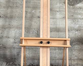 This lot features a large adjustable art studio easel made of Beechwood and in very good condition. Measures up to 6” H.