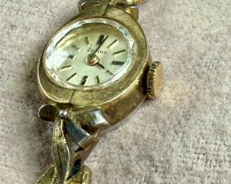 This lot features a 10k gold-filled mechanical watch by Zodiac. Winds and runs.