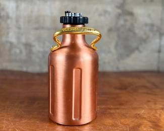 This lot features a GrowlerWerks uKeg pressurized beer growler in a copper finish. Works as it should and is in good overall condition.