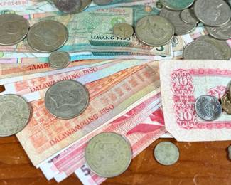 This lot features a large collection of foreign currency, primarily from the Philippines and Hong Kong.
