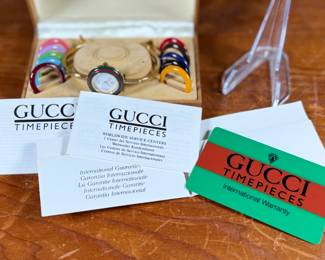 This lot features a change bezel watch by Gucci in immaculate condition with original box, papers, and warranty card. This timepiece has a gold-plated case and bracelet in exceptional condition with a mineral crystal face. You can set the watch bracelet to 15cm or 14.5cm, providing a comfortable fit for a small wrist.