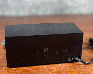 This lot features a vintage Lux electric flip clock circa 1970s in good working condition.