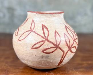 This lot features a Santo Domingo pottery pot likely circa 1920s that measures, 6” H and is in very good condition.