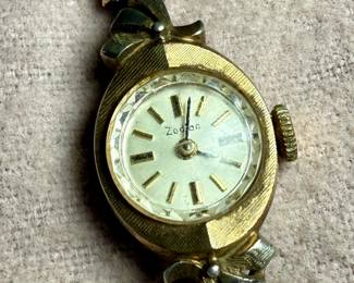 This lot features a 10k gold-filled mechanical watch by Zodiac. Winds and runs.