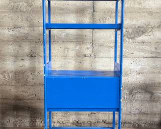 This lot features a two (2) piece wooden book or bar cart on casters with a fold down shelf. This cabinet measures, 65” H x 29.5” W x 19.5” D. Small crack that could be repaired on a caster as shown in photos.