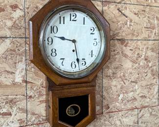 This lot features an antique 8-day clock in good running condition with a Sessions movement. Includes key and measures, 25” H x 16” W.