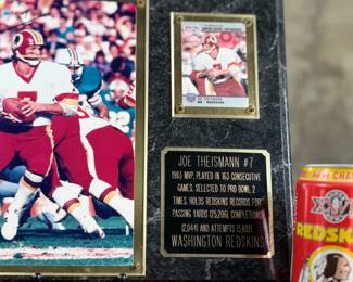 This lot features a commemorative picture plaque of Joe Theismann with an autograph on the left photograph and a card on the right. The plaque measures, 12” H x 15” W. This lot also comes with a rare 1992 Coca-Cola souvenir can commemorating the Washington Redskins’ victory in Super Bowl XXVI in excellent condition.