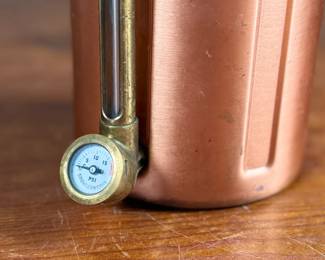 This lot features a GrowlerWerks uKeg pressurized beer growler in a copper finish. Works as it should and is in good overall condition.