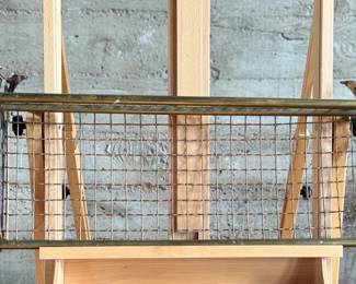 This lot features an antique brass train car luggage rack in very good condition that measures, 29.5” W x 12.5” D.