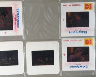 Vintage 35mm slides primarily organized in a transparent holder. Each slide features labels with the name “Richard Creamer” and addresses in Beverly Hills and Los Angeles, CA. Subjects documented include notable music acts that are believed to be Steve Winwood, Donna Summer, and others.