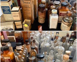 Large collection of antique apothecary jars and bottles
