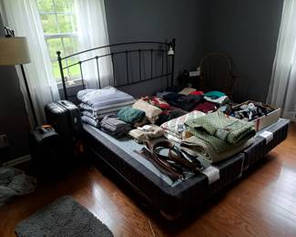 King size bed, (no mattress), clothing suitcases, etc