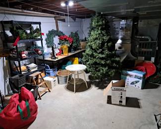 two lighted Christmas trees & other decorations