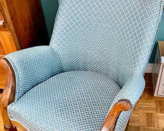 vintage blue upholstered armchair with a wooden frame resembling French or Queen Anne style