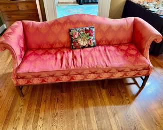 Vintage Chippendale-style camelback sofa with red damask upholstery and mahogany legs.